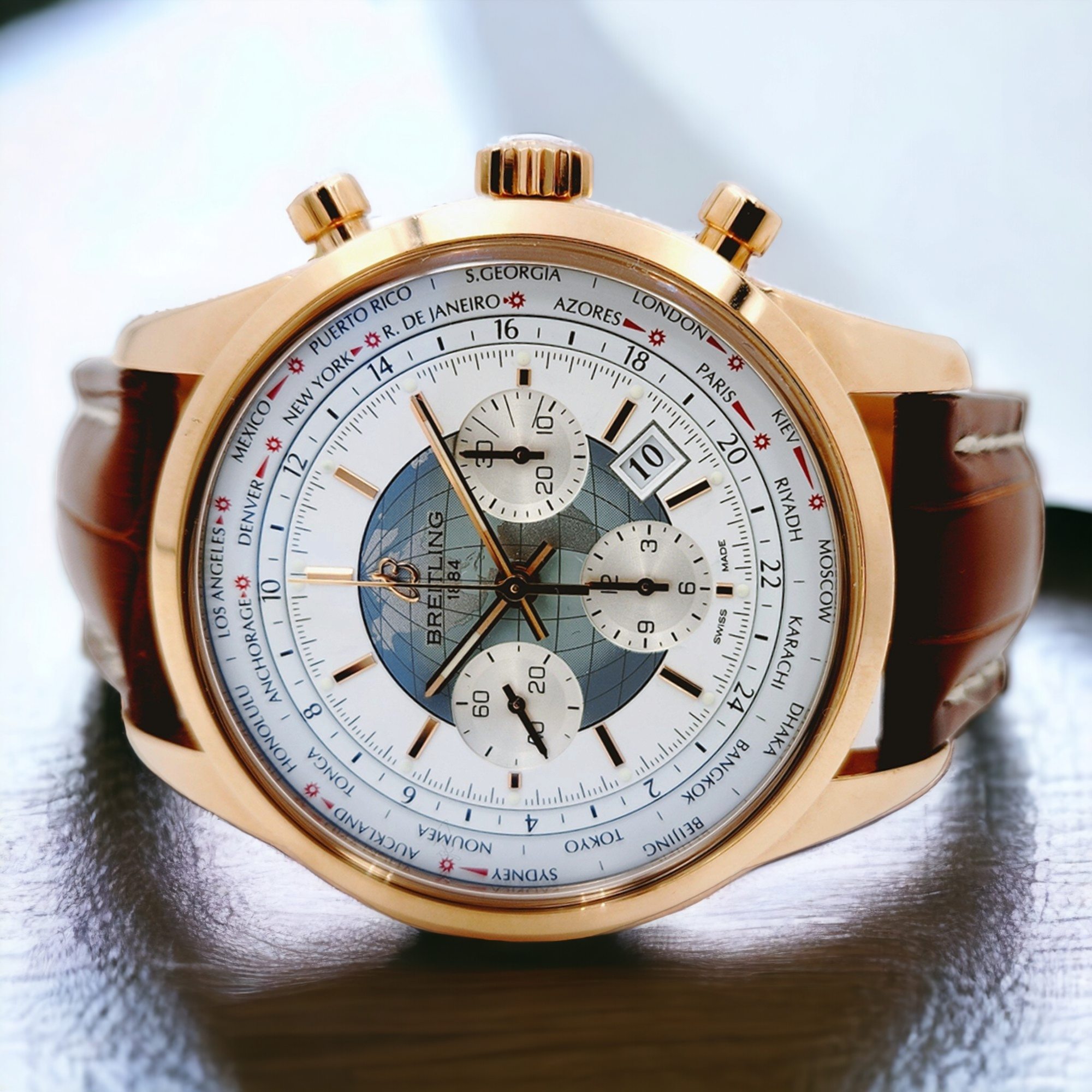 *Men's Breitling 46mm Transocean Watch in 18K Rose Gold with Brown Leather Band and White Chronograph Dial. (Pre-Owned)