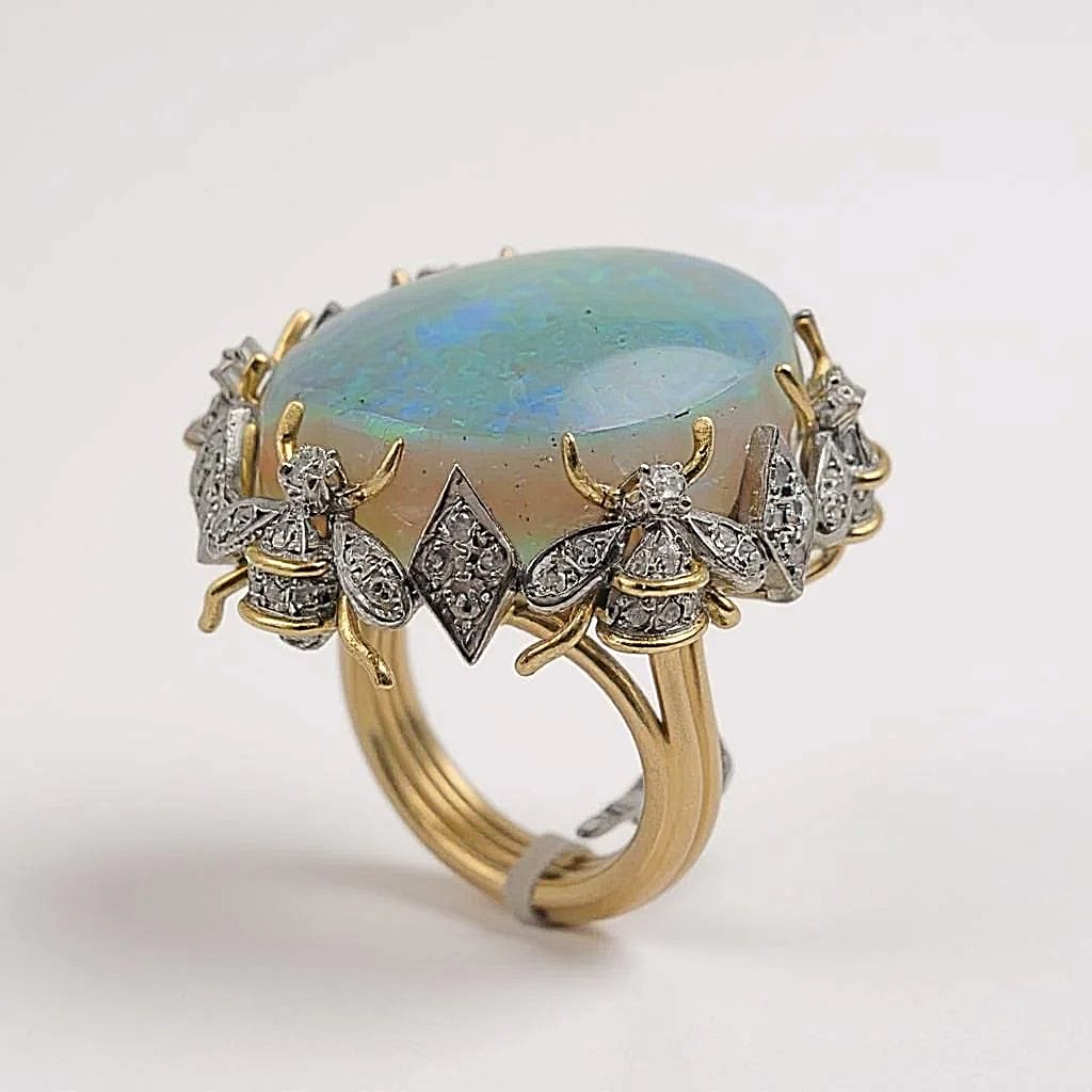 Estimated 30 to 35 Carat Australian Multi Color Fiery Antique Art Deco Fancy Rainbow Crystal Opal Ring with 1.00CT SI2-G Diamonds in 14K Yellow Gold.