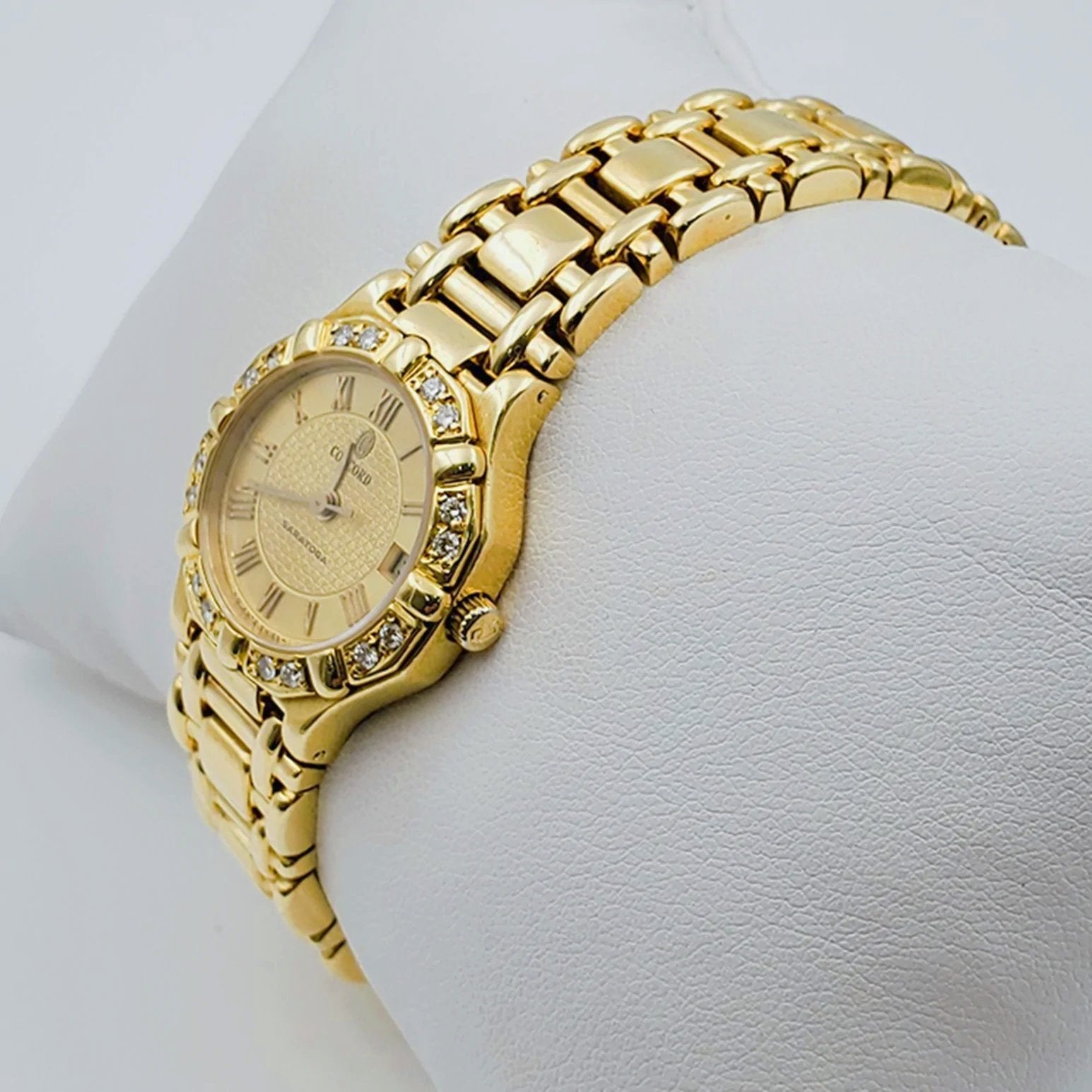 Women's Concord Sarento 24mm Solid 18K Yellow Gold Band Watch with Roman Numeral Gold Dial and Diamond Bezel. (Pre-Owned)