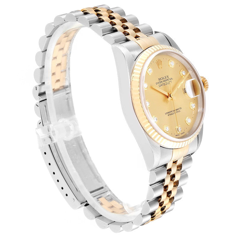 Ladies Rolex 26mm DateJust Two Tone 18K Yellow Gold / Stainless Steel Watch with Champagne Diamond Dial and Fluted Bezel. (Pre-Owned 69173)