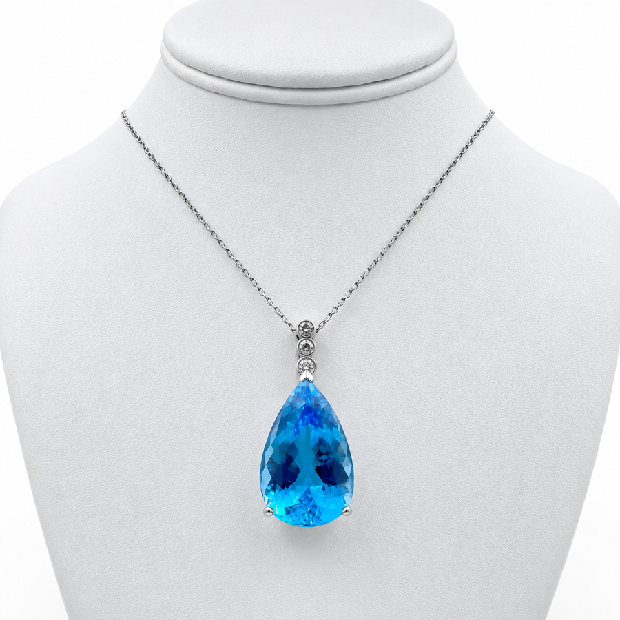 14k White Gold Pendant with 57 Ct. Blue Topaz and 18" Necklace.
