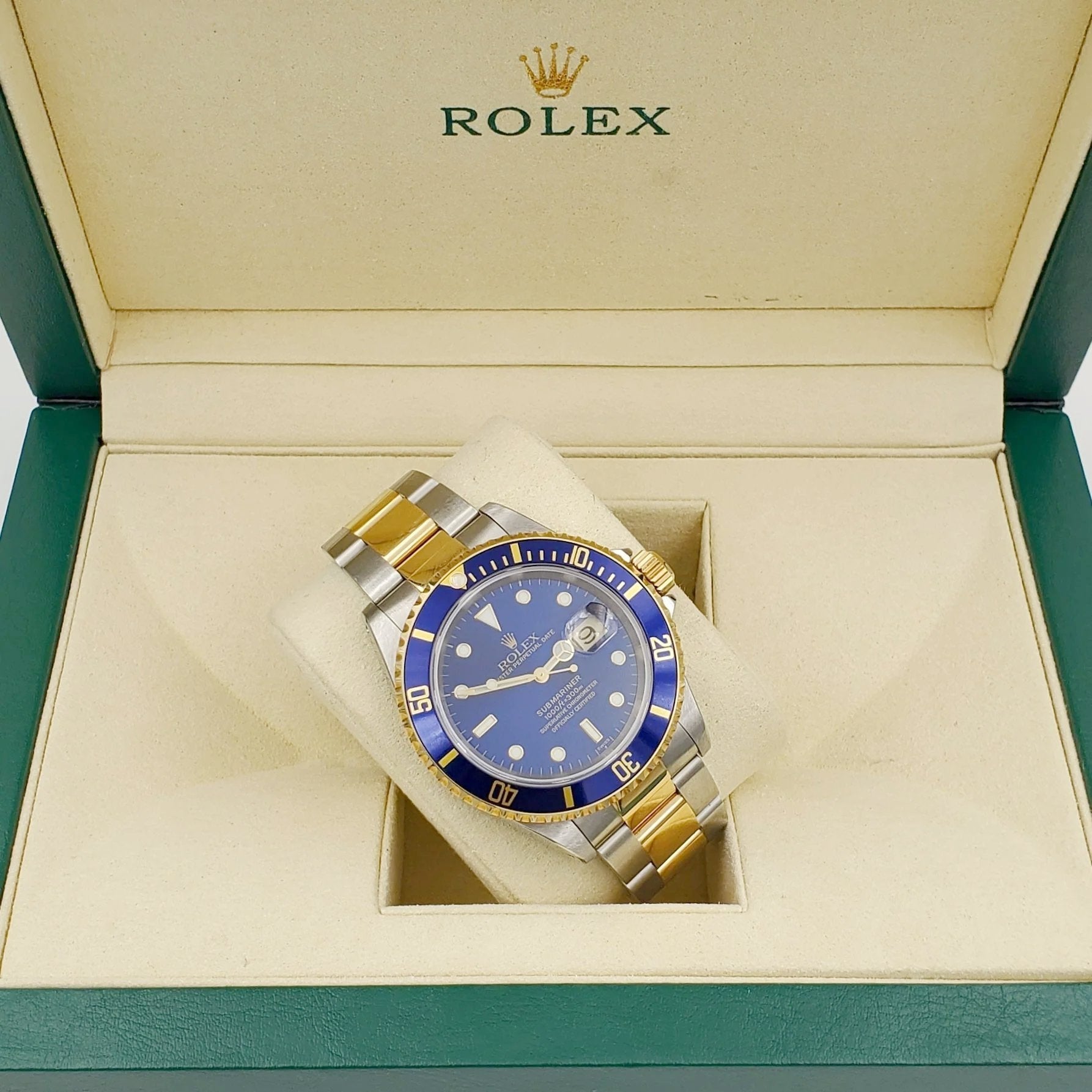 1996 Men's Rolex 40mm Submariner Oyster Perpetual Two Tone 18K Yellow Gold / Stainless Steel Watch with Blue Dial and Blue Bezel. (Pre-Owned 16613)