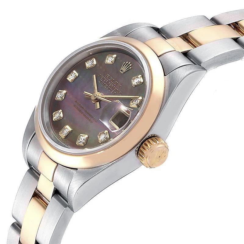 1999 Ladies Rolex 26mm DateJust Two Tone 18K Yellow Gold / Stainless Steel Watch with Mother of Pearl Diamond Dial and Smooth Bezel. (Pre-Owned 79163)