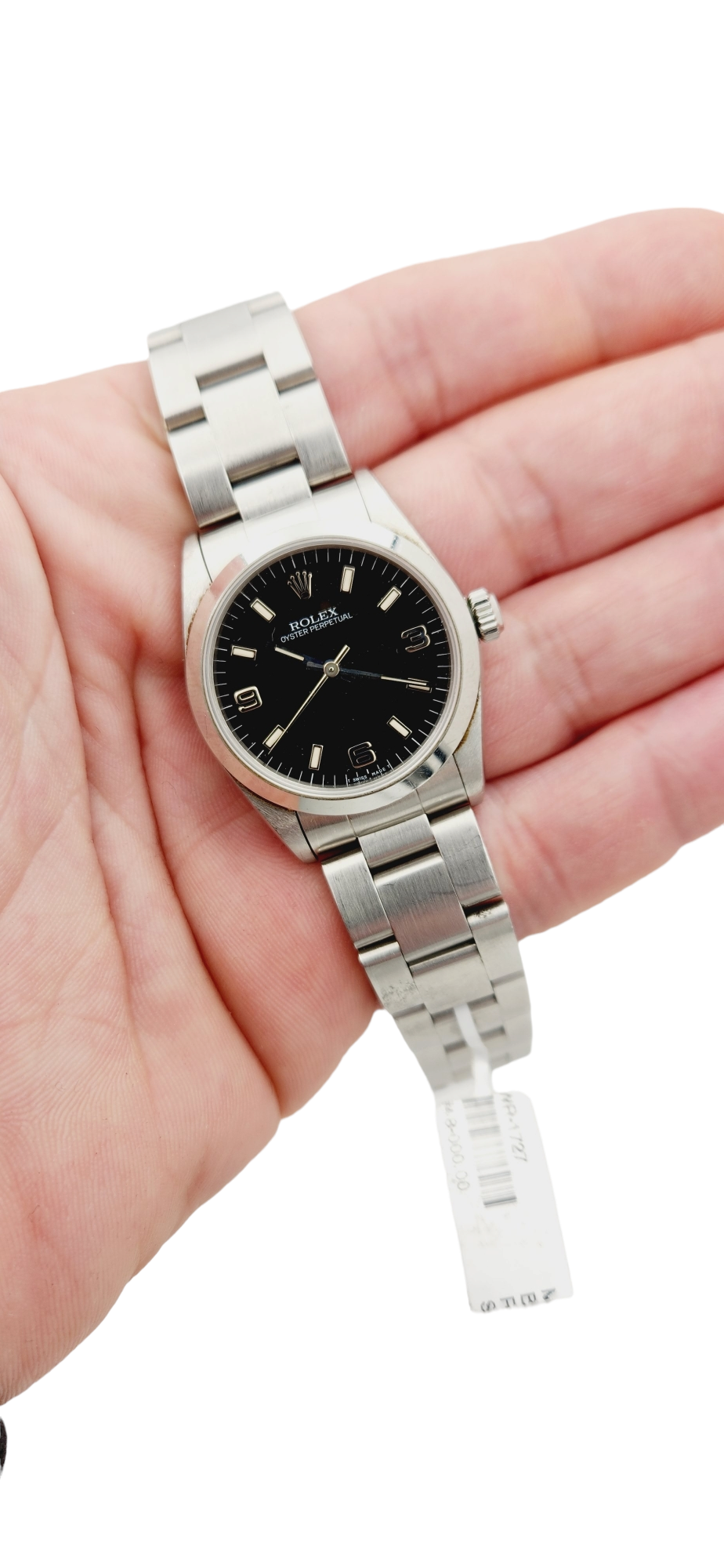 Ladies Rolex 31mm Midsize Oyster Perpetual Stainless Steel Watch with Black Dial and Smooth Bezel. (Pre-Owned 67480)