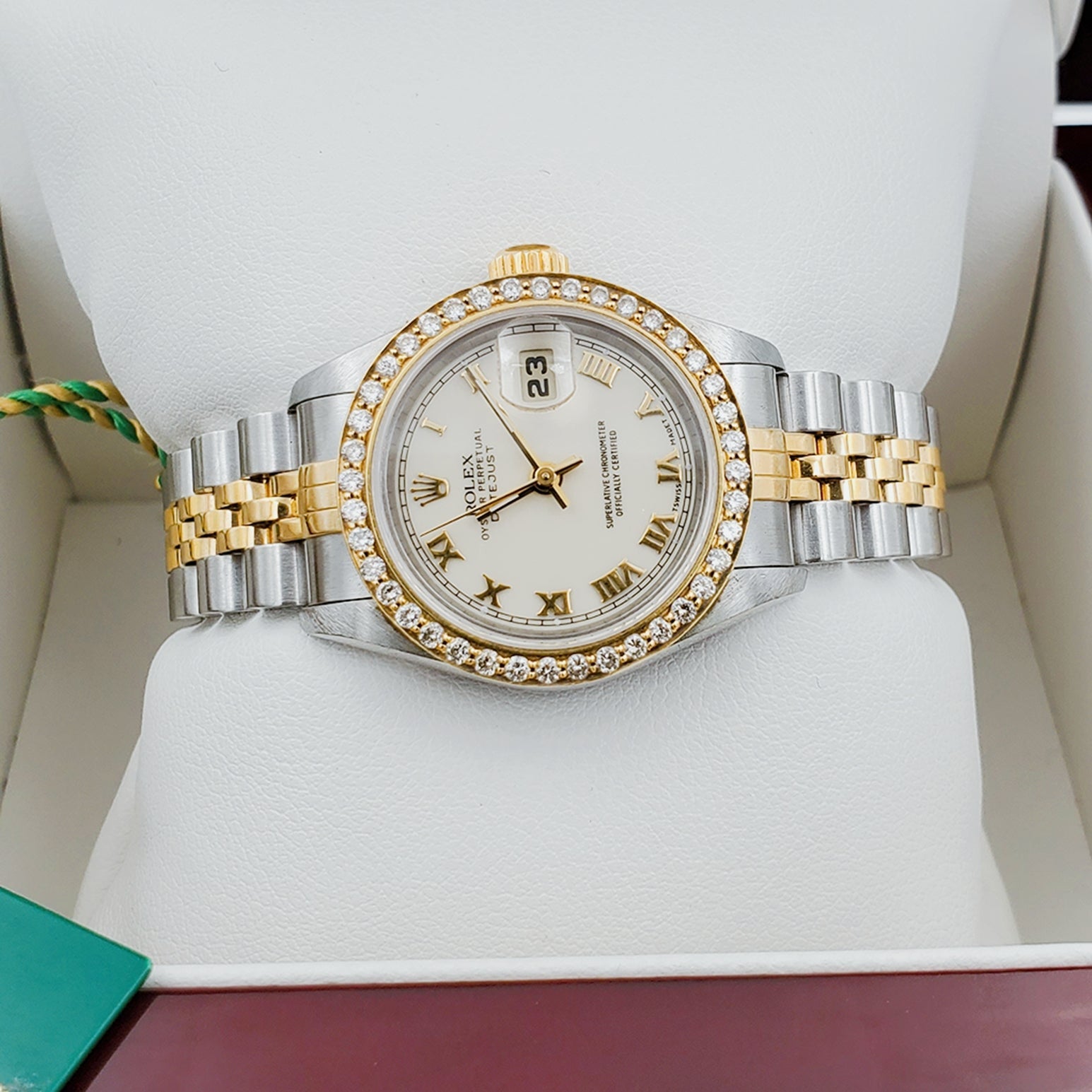 Ladies Rolex 18K Gold Two Tone 26mm DateJust Wristwatch w/ Off-White Dial, Roman Numerals & Diamond Bezel. (Pre-Owned)