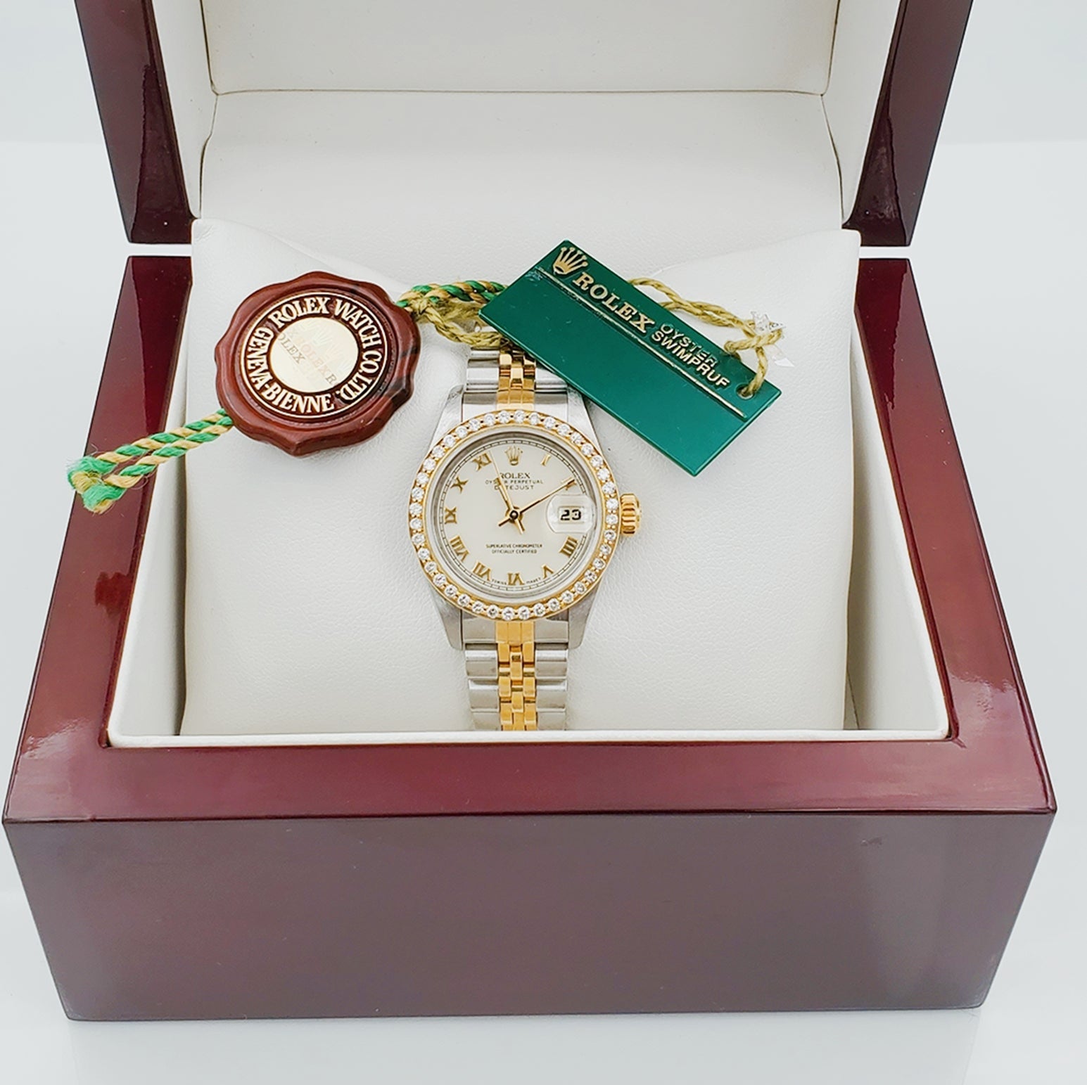 Ladies Rolex 18K Gold Two Tone 26mm DateJust Wristwatch w/ Off-White Dial, Roman Numerals & Diamond Bezel. (Pre-Owned)