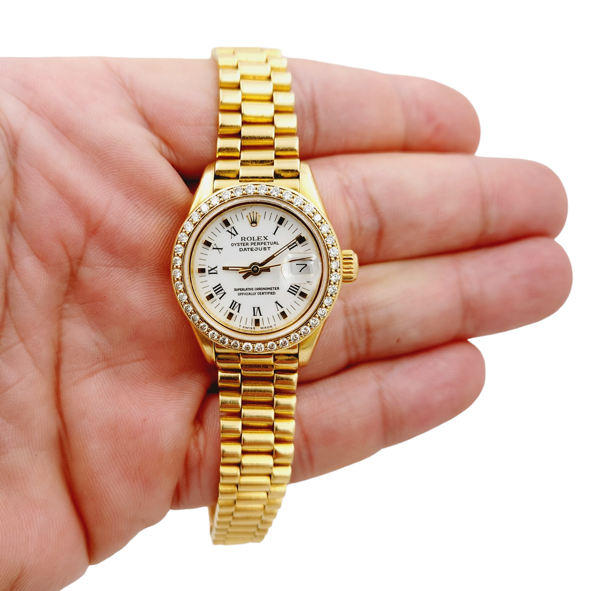 Ladies Rolex 26mm Presidential 18K Yellow Gold Watch with White Roman Numeral Dial and Diamond Bezel. (Pre-Owned 69178)