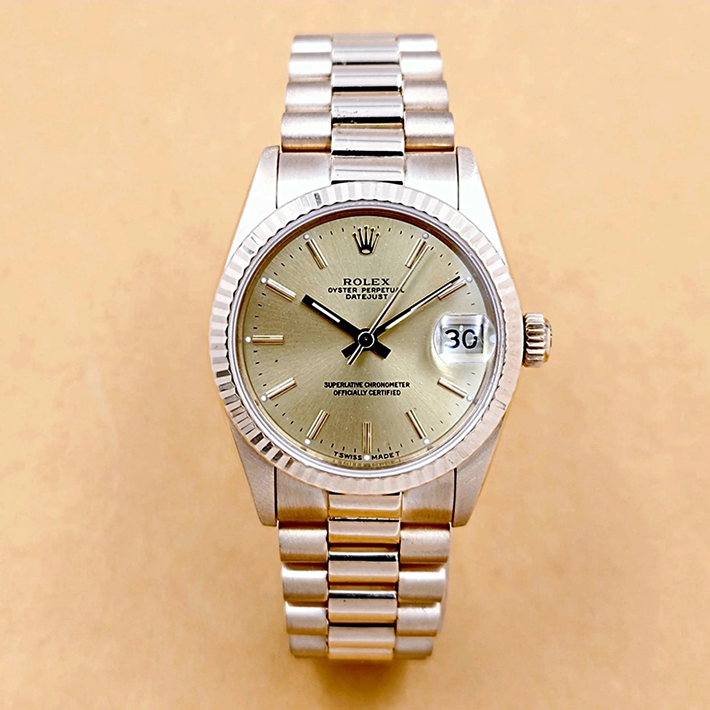 Ladies Rolex 31mm Midsize Presidential 18K Solid Yellow Gold Watch with Champagne Dial and Fluted Bezel. (Pre-Owned 63278)