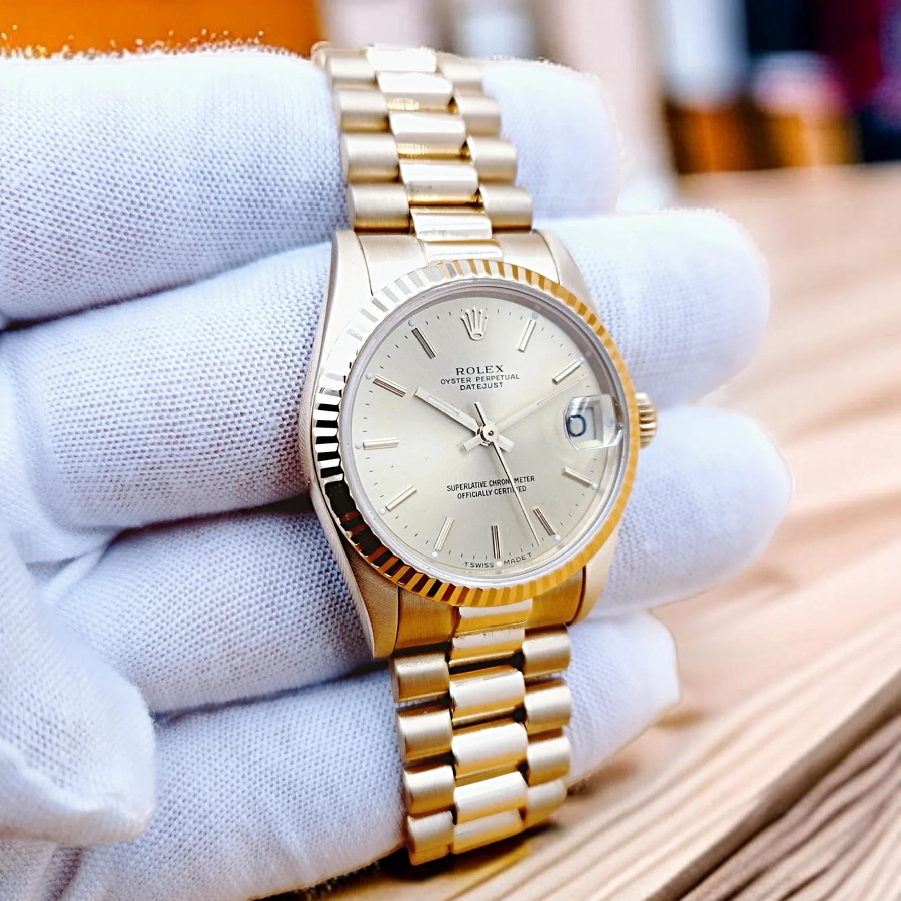 Ladies Rolex 31mm Midsize Presidential 18K Solid Yellow Gold Watch with Champagne Dial and Fluted Bezel. (Pre-Owned 63278)