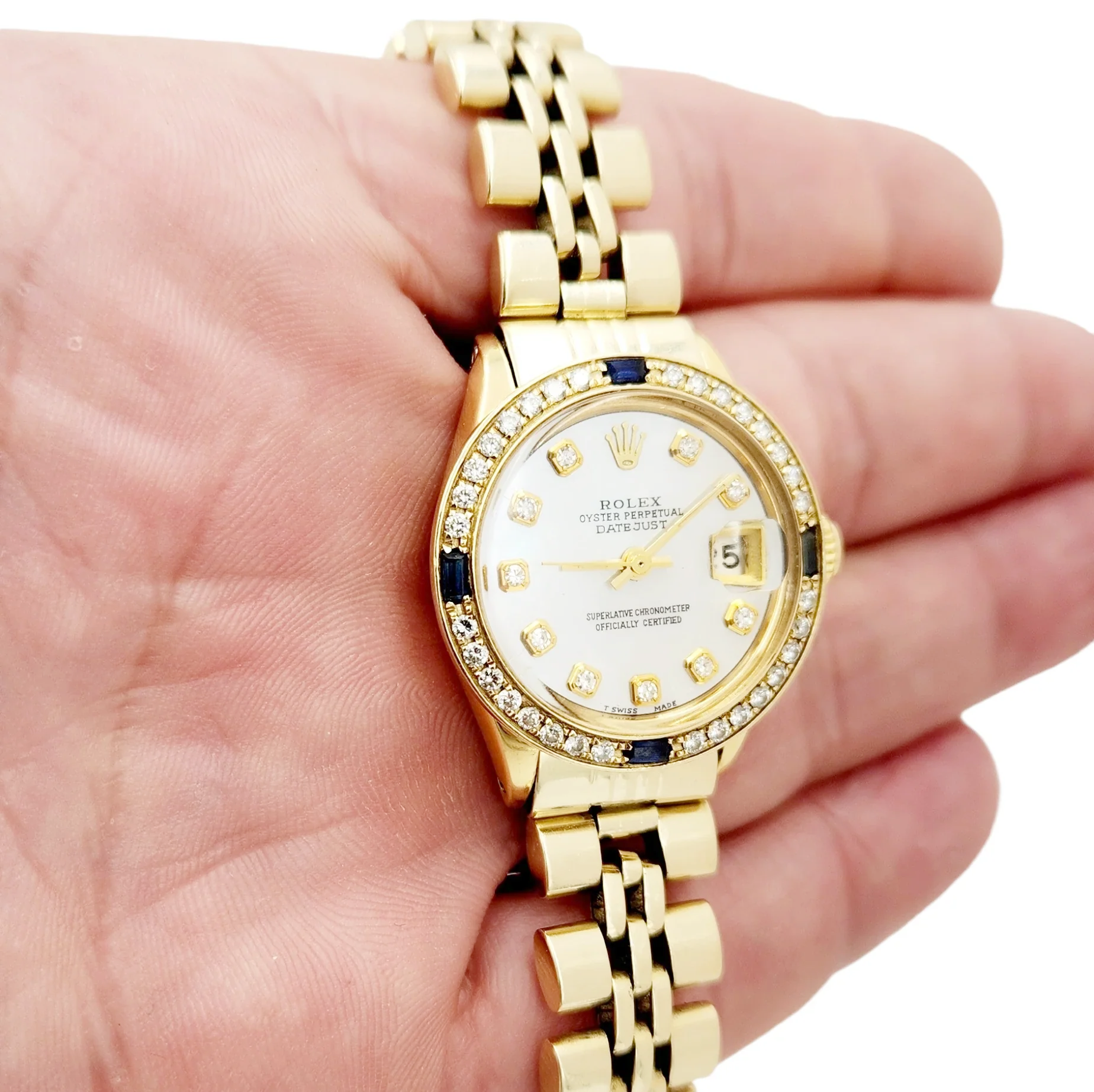 Ladies Rolex DateJust 26mm Vintage Solid 14K Yellow Gold Watch with Mother of Pearl Diamond Dial and Blue Sapphire Diamond Bezel. (Pre-Owned 6517)