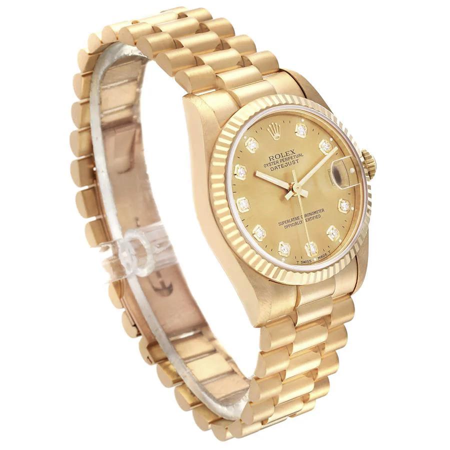 Ladies Rolex 31mm Midsize Presidential 18K Solid Yellow Gold Watch with Champagne Diamond Dial and Fluted Bezel. (Pre-Owned)