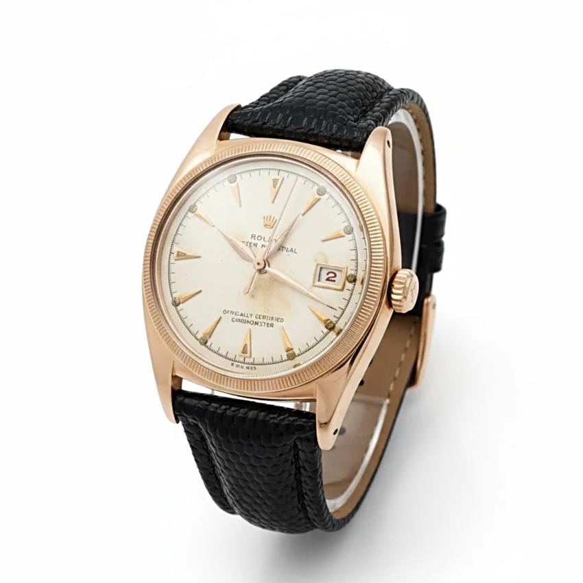 *Men's Rolex 36mm Vintage 1950 Bubbleback Oyster Perpetual Rose Gold Watch with Cream Dial and Black Leather Strap. (Pre-Owned 6075)