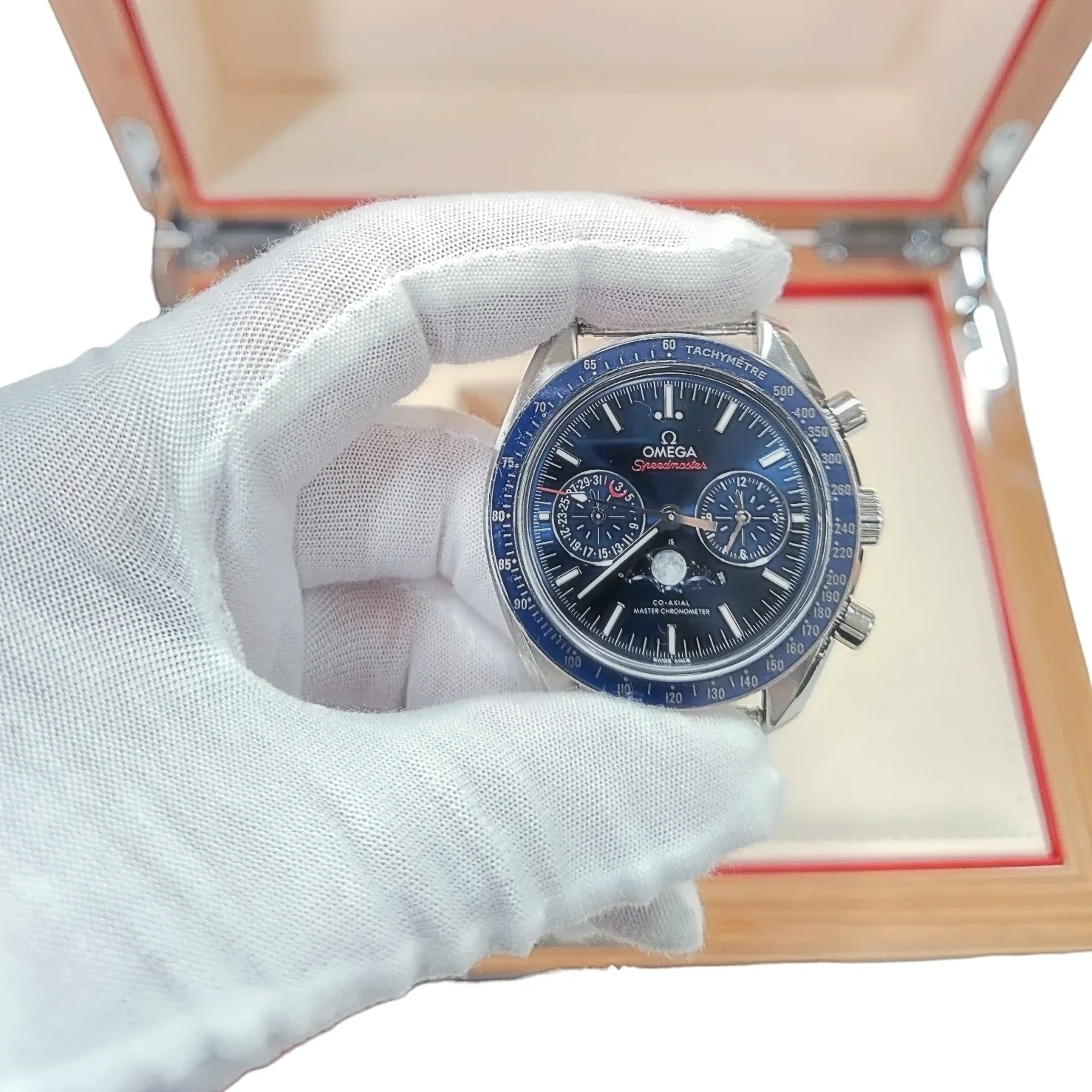 Men's Omega 44mm Speedmaster Moonphase Automatic Steel Watch with Blue Luminous Dial. (Pre-Owned Box/Card)