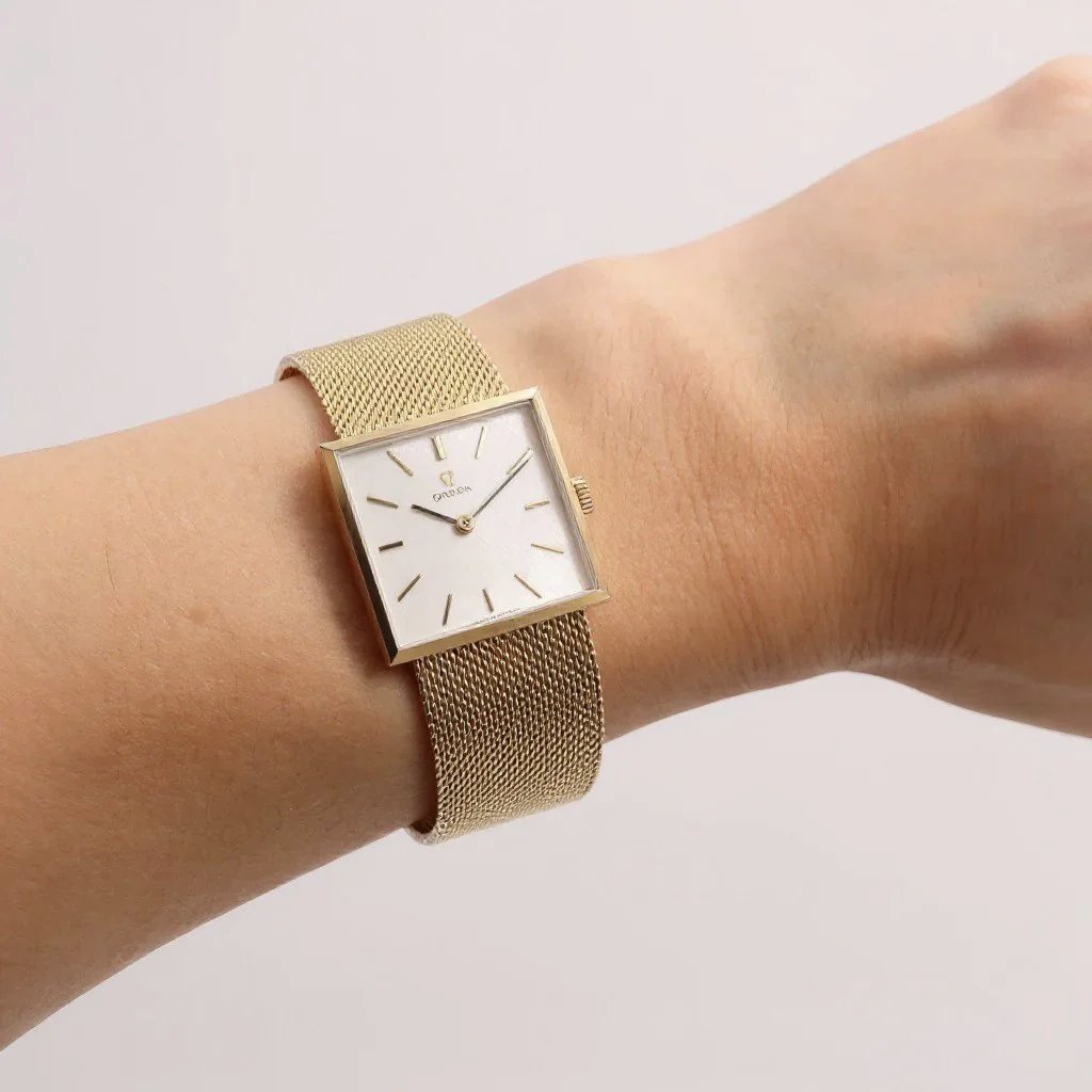 Unisex Omega 23mm Vintage 14K Yellow Gold Watch with Mesh Band and Silver Dial. (Pre-Owned)