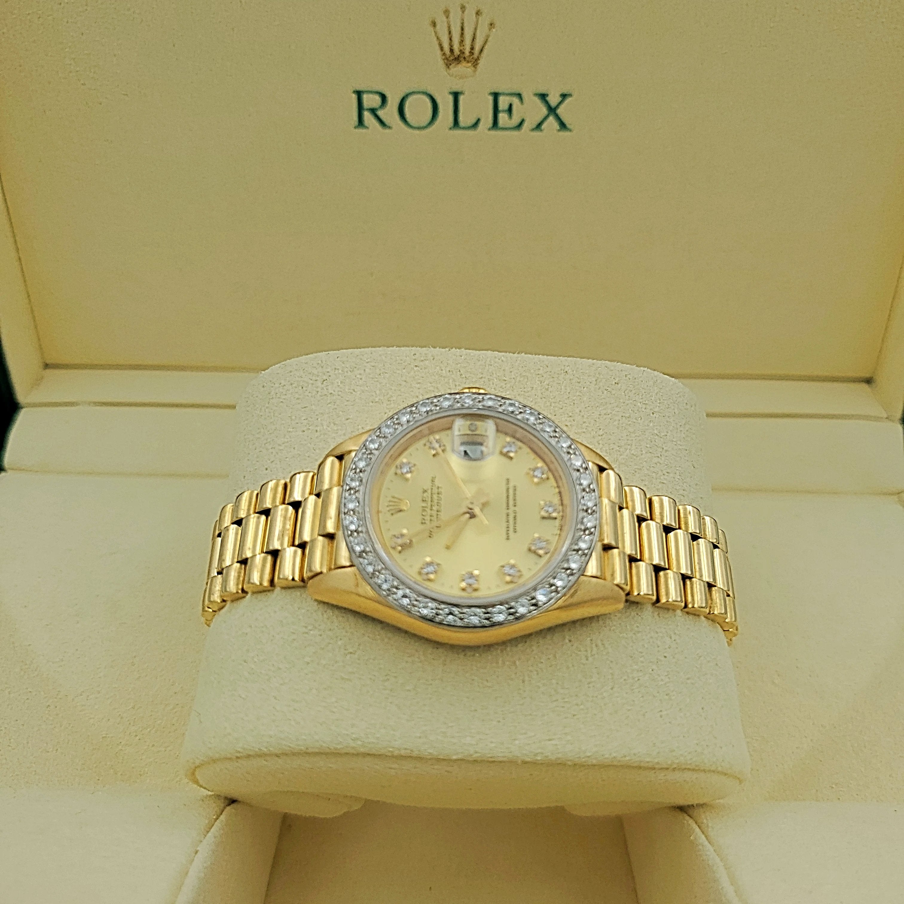 Ladies Rolex 26mm Presidential 18K Yellow Gold Watch with Champagne Diamond Dial and Diamond Bezel. (Pre-Owned)
