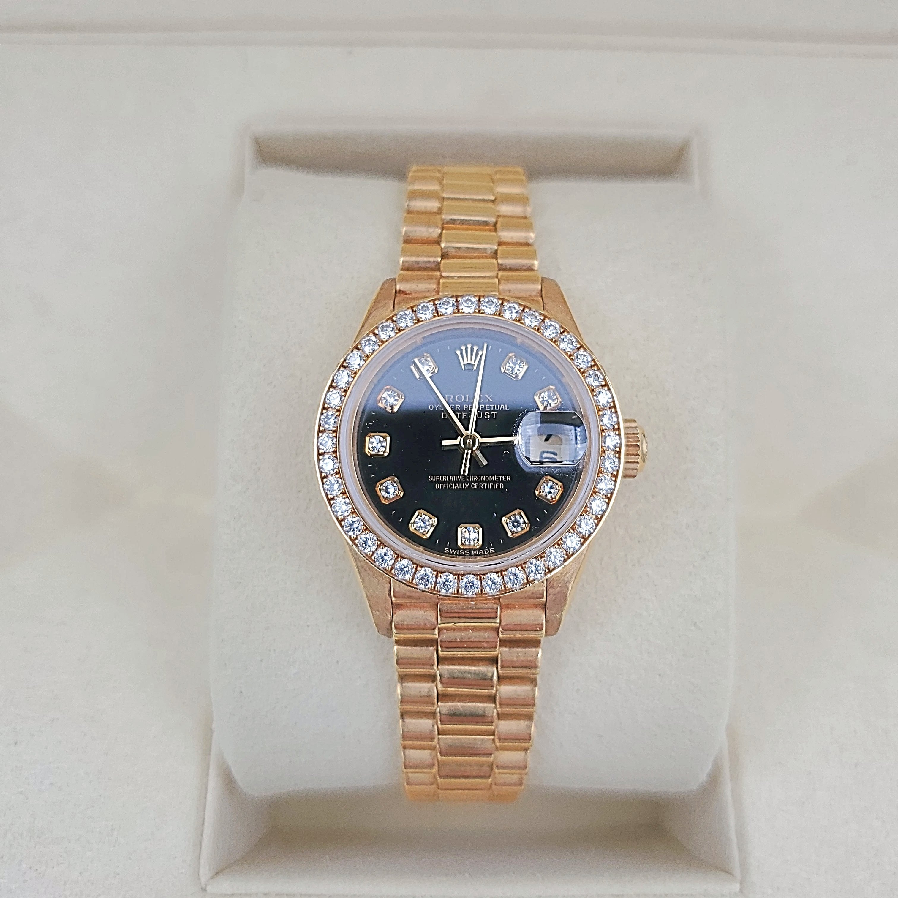 Ladies Rolex 26mm Presidential 18K Yellow Gold Watch with Black Diamond Dial and Diamond Bezel. (Pre-Owned)