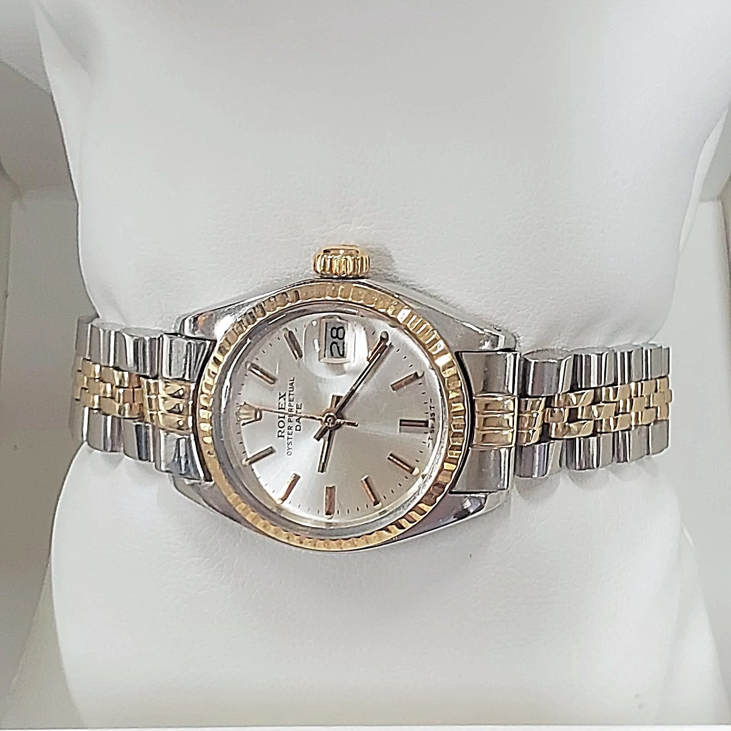 Ladies Rolex 26mm DateJust Two Tone 14K Yellow Gold / Stainless Steel Watch with Silver Dial and Fluted Bezel. (Pre-Owned)