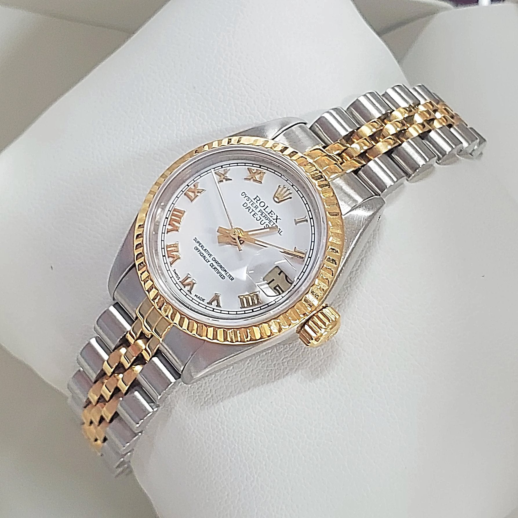 Women's Rolex 18K Gold 26mm Two-Tone DateJust Watch, with Fluted Bezel, White Dial, and Roman Numerals.