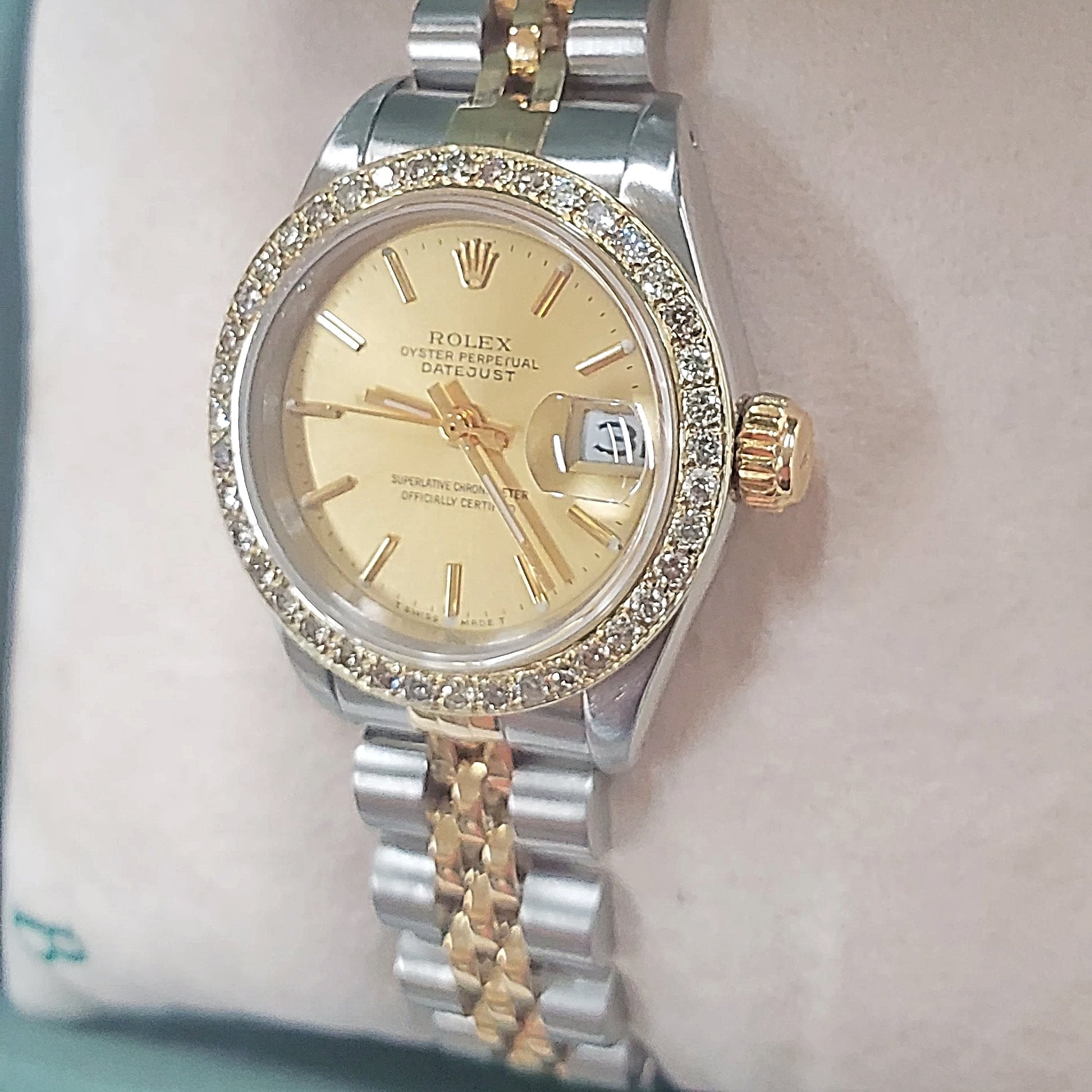 Ladies Rolex 26mm DateJust Two Tone 18K Gold Watch with Champagne Dial and Custom Diamond Bezel. (Pre-Owned)