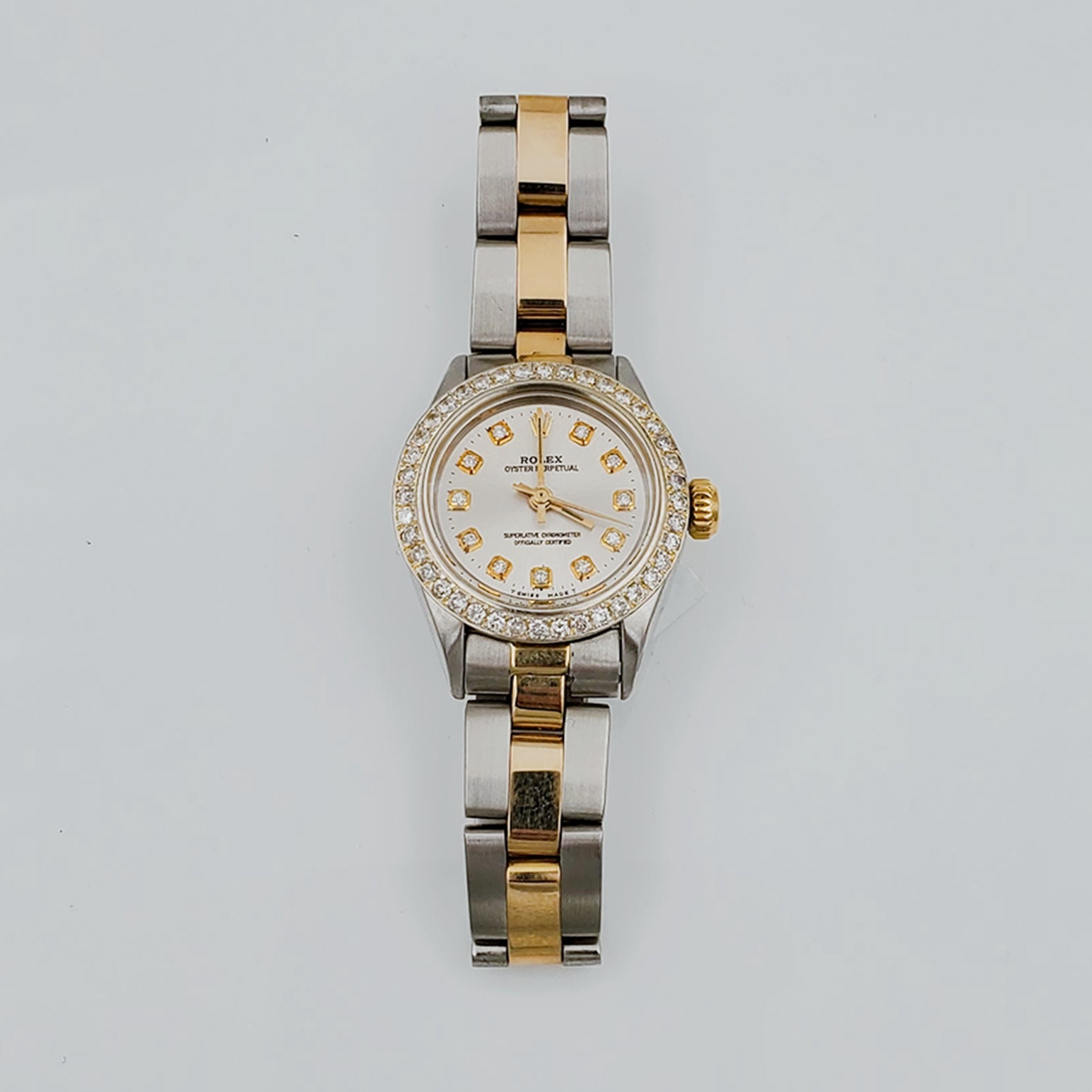 Ladies Rolex 26mm DateJust 18K Two Tone Watch with Silver Diamond Dial and Custom Diamond Bezel. (Pre-Owned)