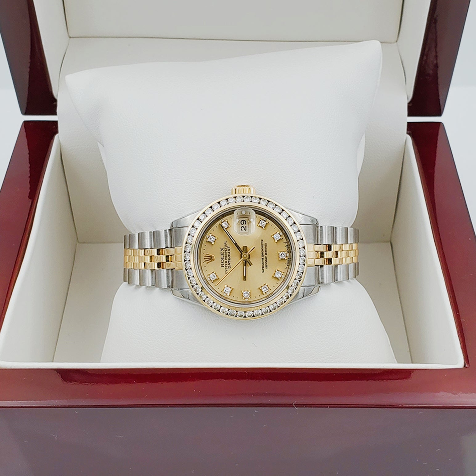 Ladies Rolex 26mm DateJust 18K Gold / Two Tone Stainless Steel Watch with Champagne Diamond Dial and Diamond Bezel. (Pre-Owned)