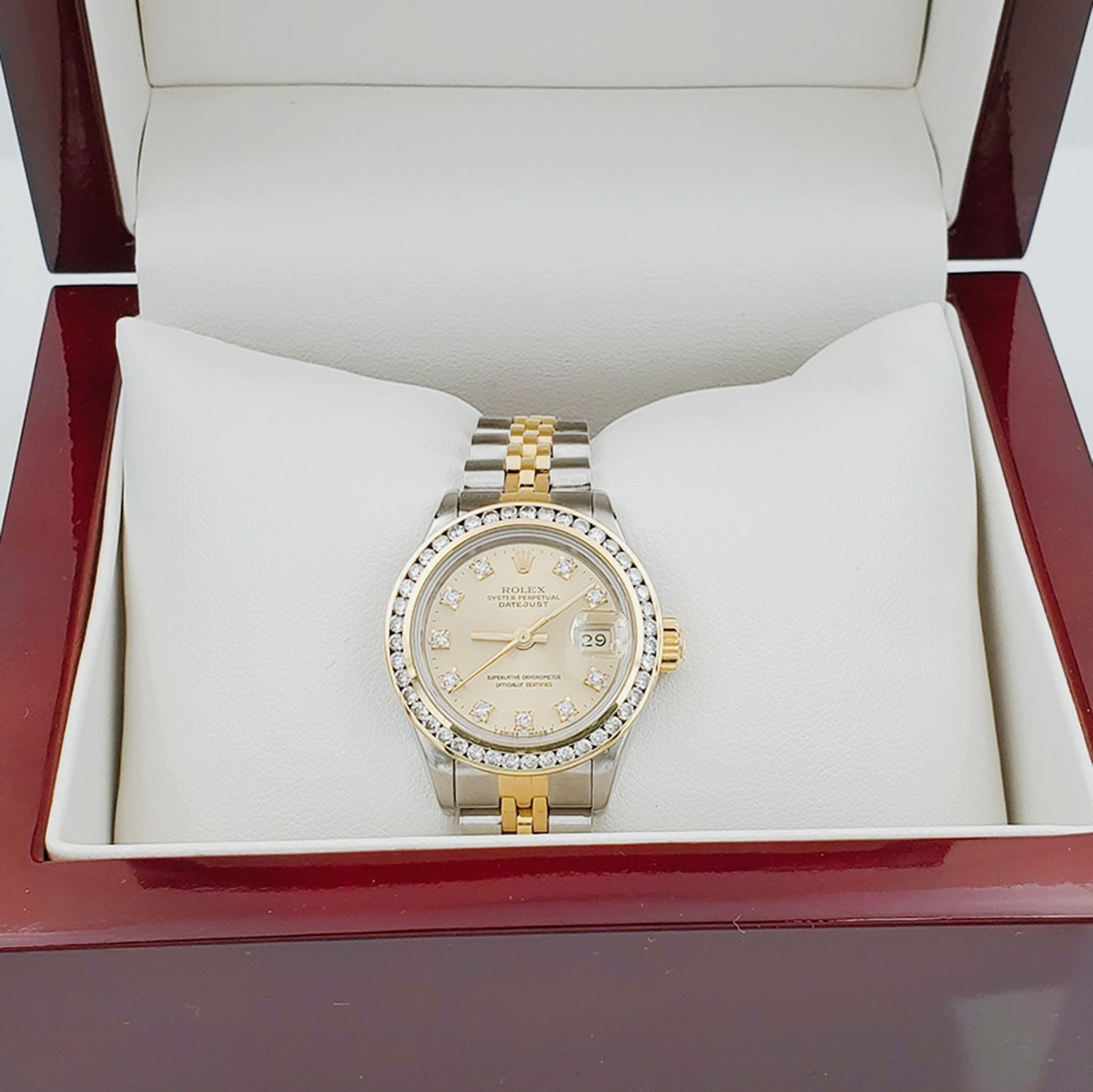 Ladies Rolex 26mm DateJust 18K Gold / Two Tone Stainless Steel Watch with Champagne Diamond Dial and Diamond Bezel. (Pre-Owned)