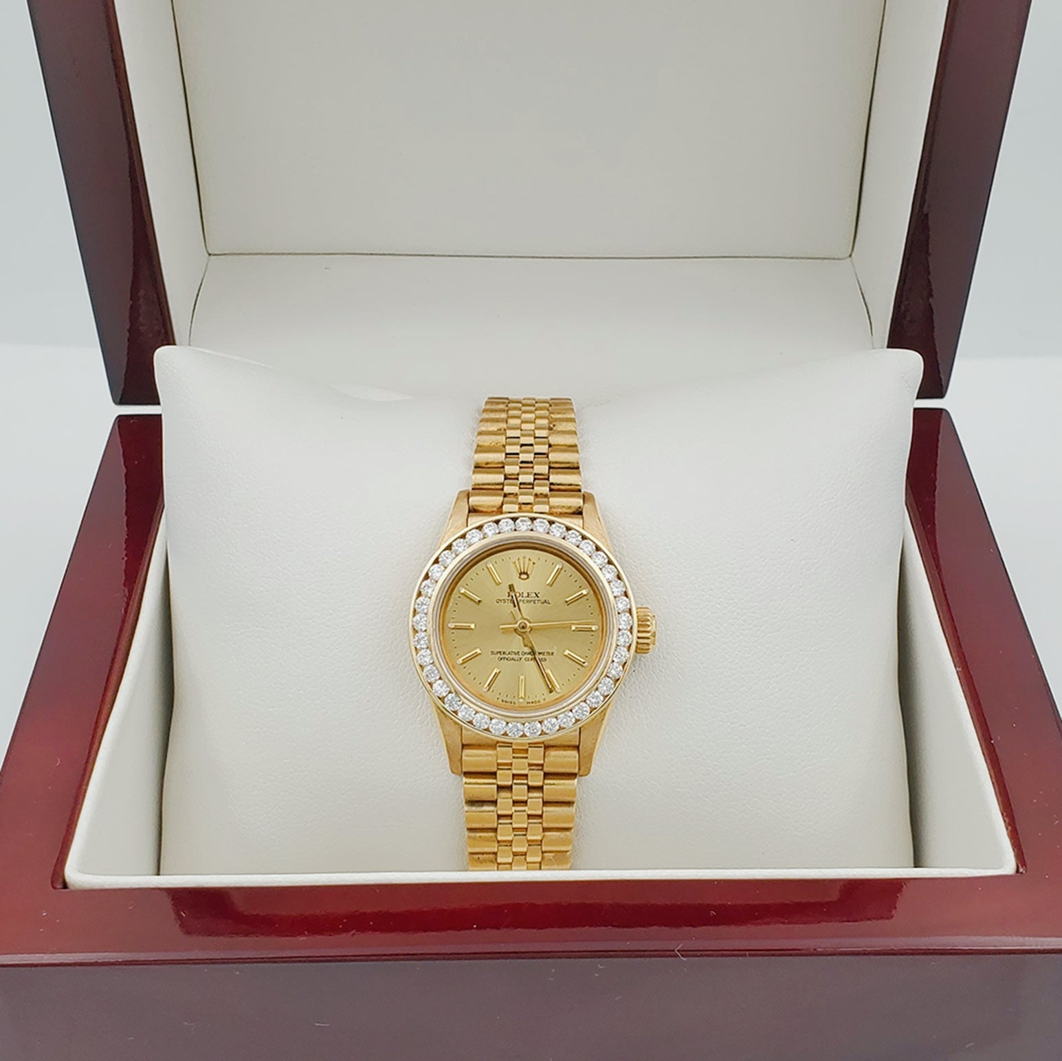 Ladies Rolex 26mm DateJust 18K Solid Yellow Gold Watch with Champagne Dial and Custom Diamond Bezel. (Pre-Owned)