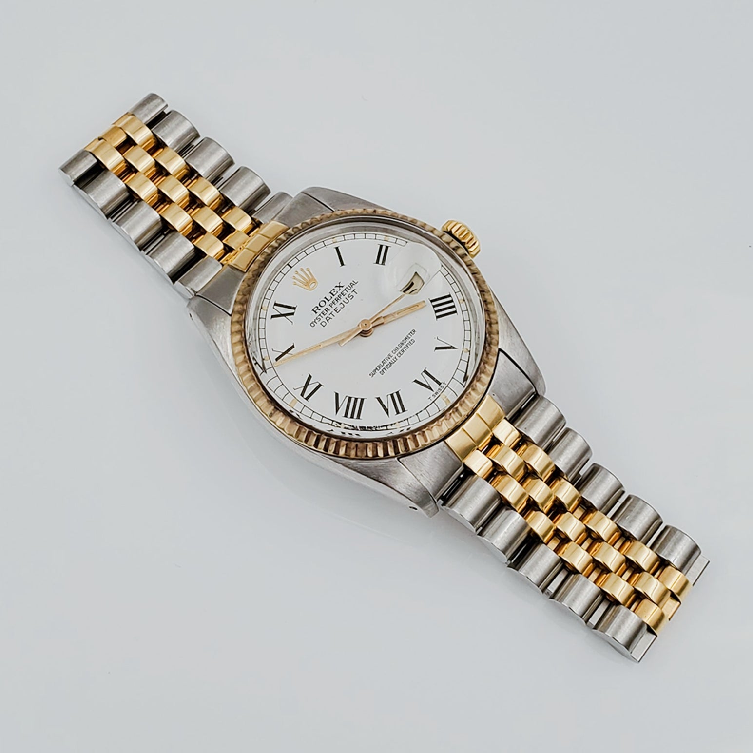 Men's Rolex 36mm Vintage DateJust 18k Gold / Stainless Steel Two Tone Watch with White Dial, Roman Numeral and Fluted Bezel. (Pre-Owned)