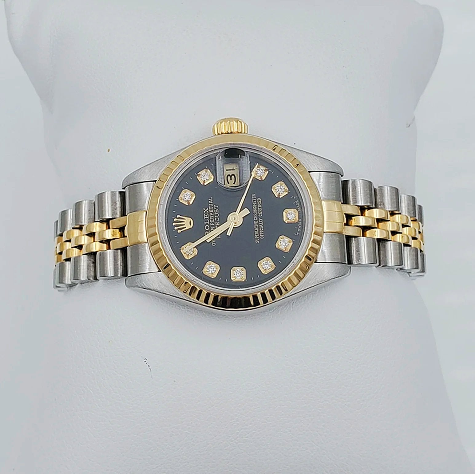 Ladies Rolex 26mm DateJust Two Tone 18K Yellow Gold / Stainless Steel Watch with Black Diamond Dial and Fluted Bezel. (Pre-Owned)