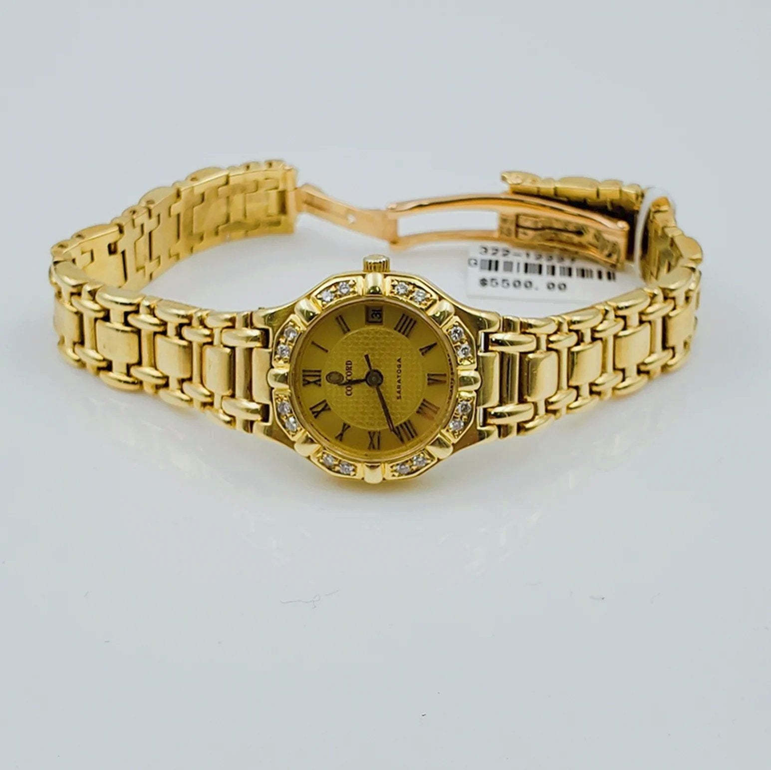 Ladies Concord Sarento 24mm Solid 18K Yellow Gold Band Watch with Roman Numeral Gold Dial and Diamond Bezel. (Pre-Owned)