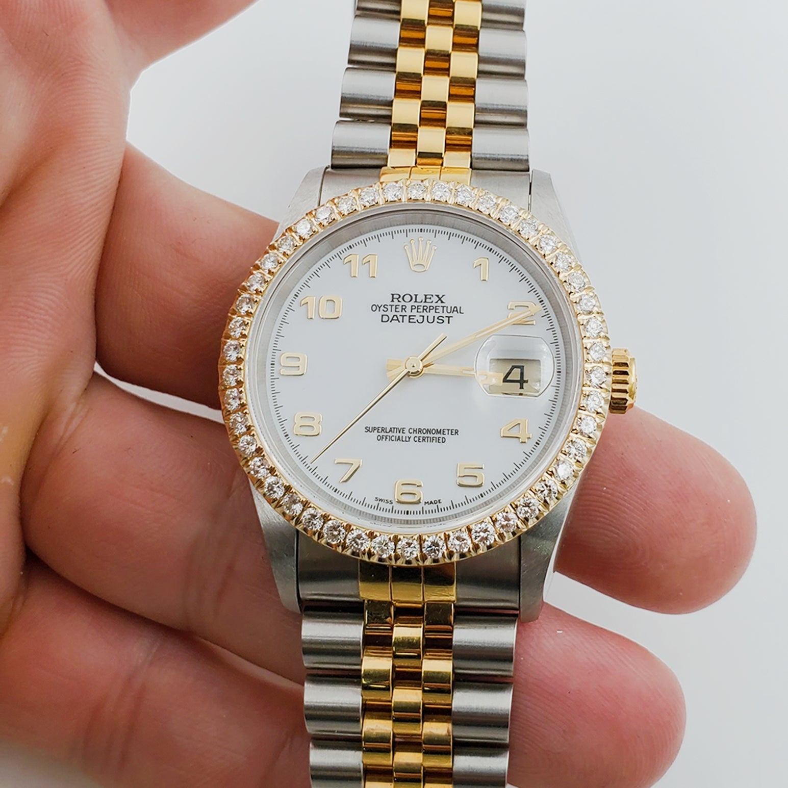 Men's Rolex 36mm DateJust 18K Gold / Stainless Steel Two Tone Watch with White Dial and 1.5 CT Custom Diamond Bezel. (NEW 16233)
