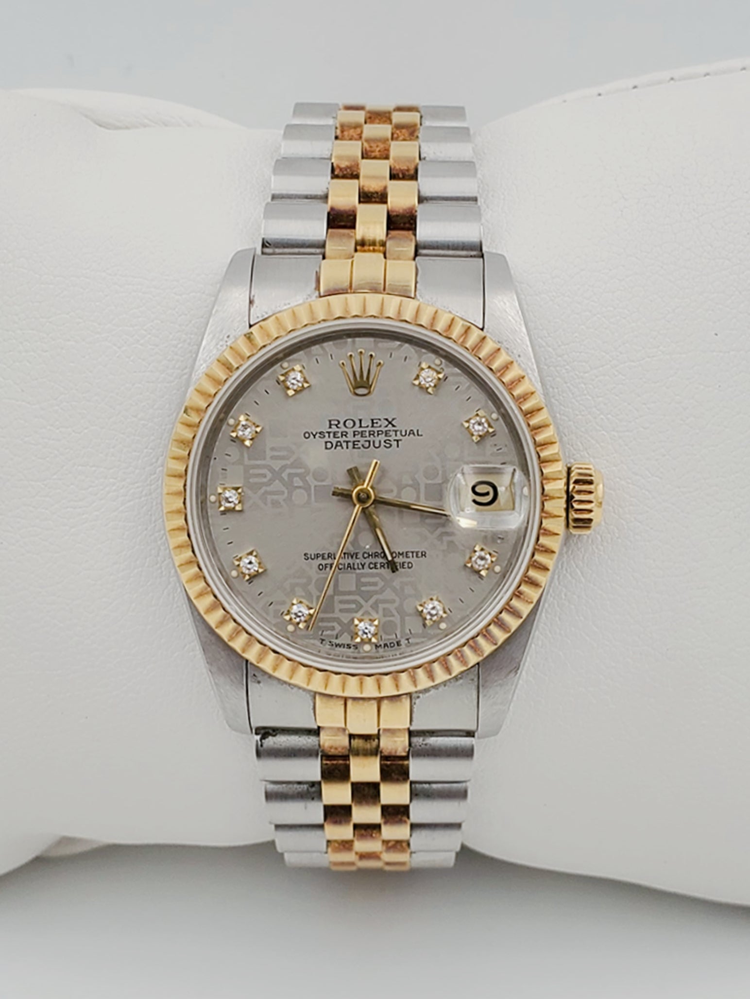 Ladies Rolex Midsize 31mm DateJust Two Tone 18K Yellow Gold / Stainless Steel Watch with Silver Diamond Dial and Fluted Bezel. (Pre-Owned 682735)