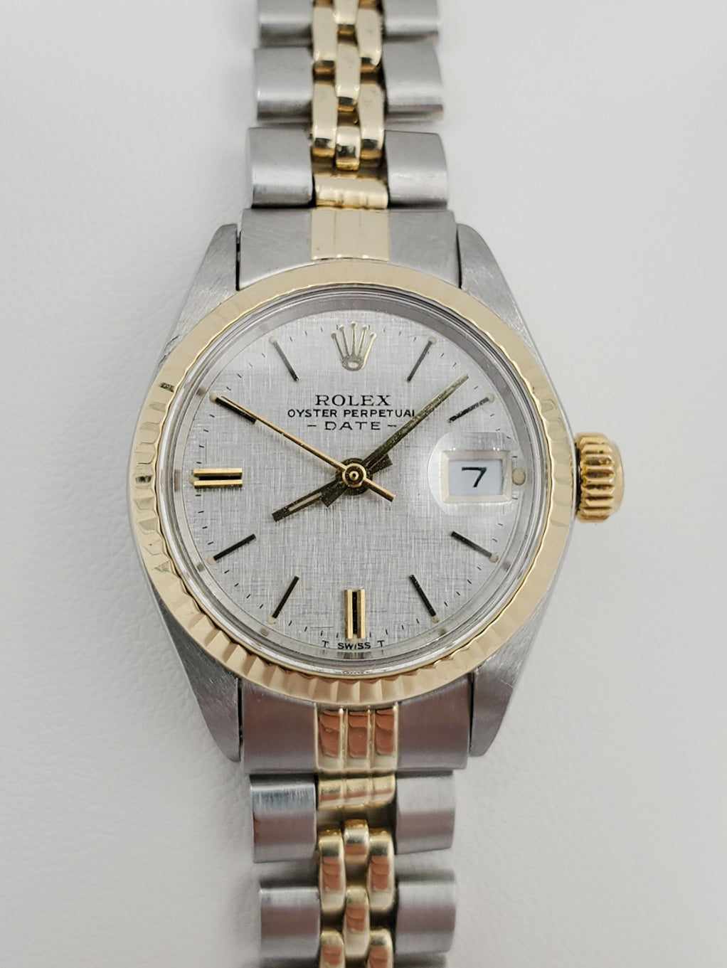 Ladies Rolex 26mm Date Vintage Two Tone 14K Yellow Gold / Stainless Steel Watch with Silver Dial and Fluted Bezel. (Pre-Owned)