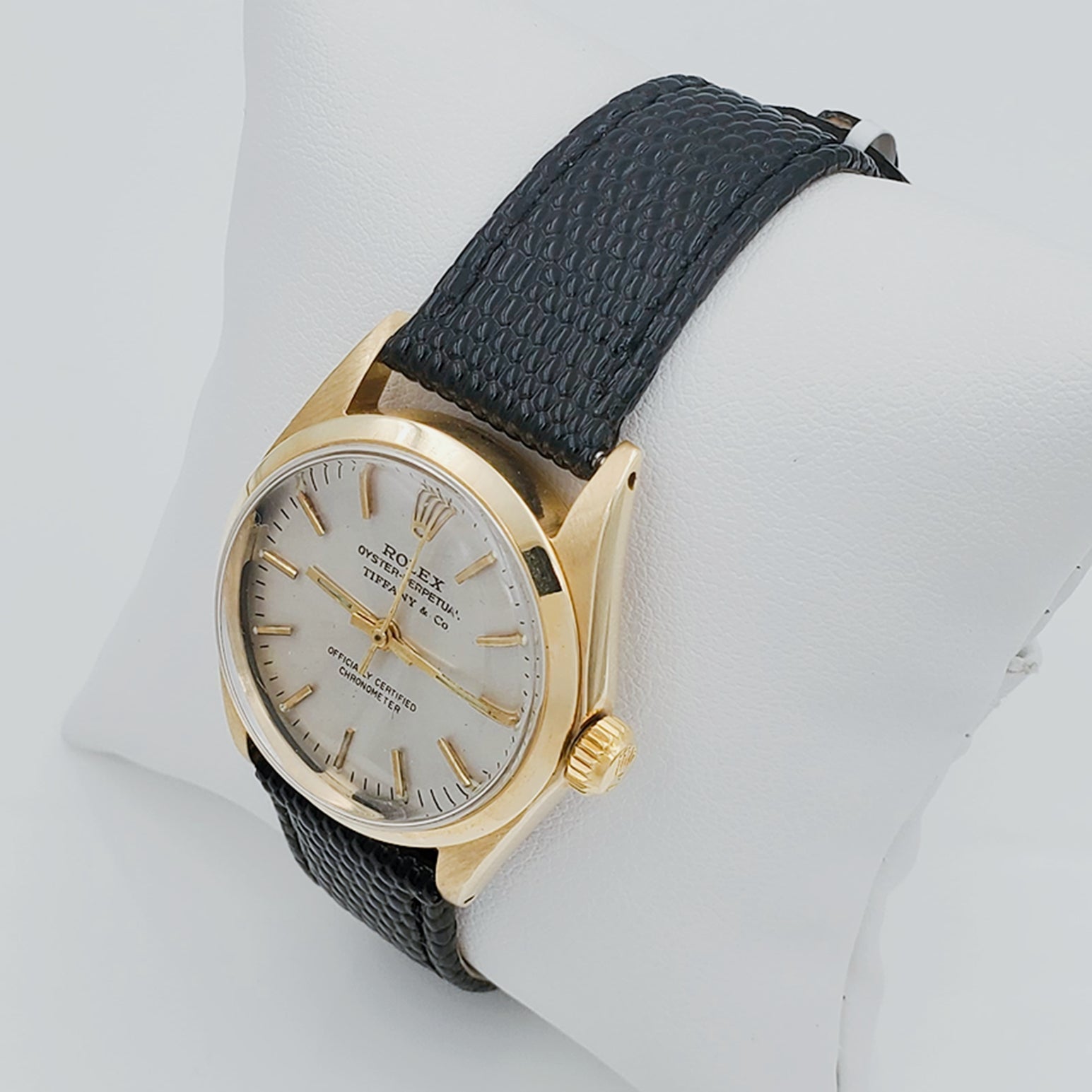 Men's Rolex 30mm Vintage Oyster Perpetual Tiffany 14K Yellow Gold Watch with Black Leather Strap and Off-White Dial. (Pre-Owned)