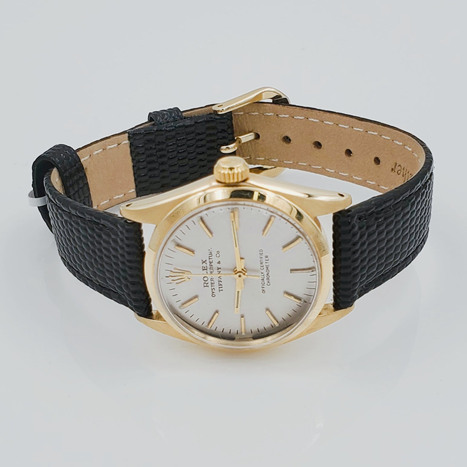 Men's Rolex 30mm Vintage Tiffany & Co. Oyster Perpetual 14K Yellow Gold Watch with Black Leather Strap and Off-White Dial. (Pre-Owned)