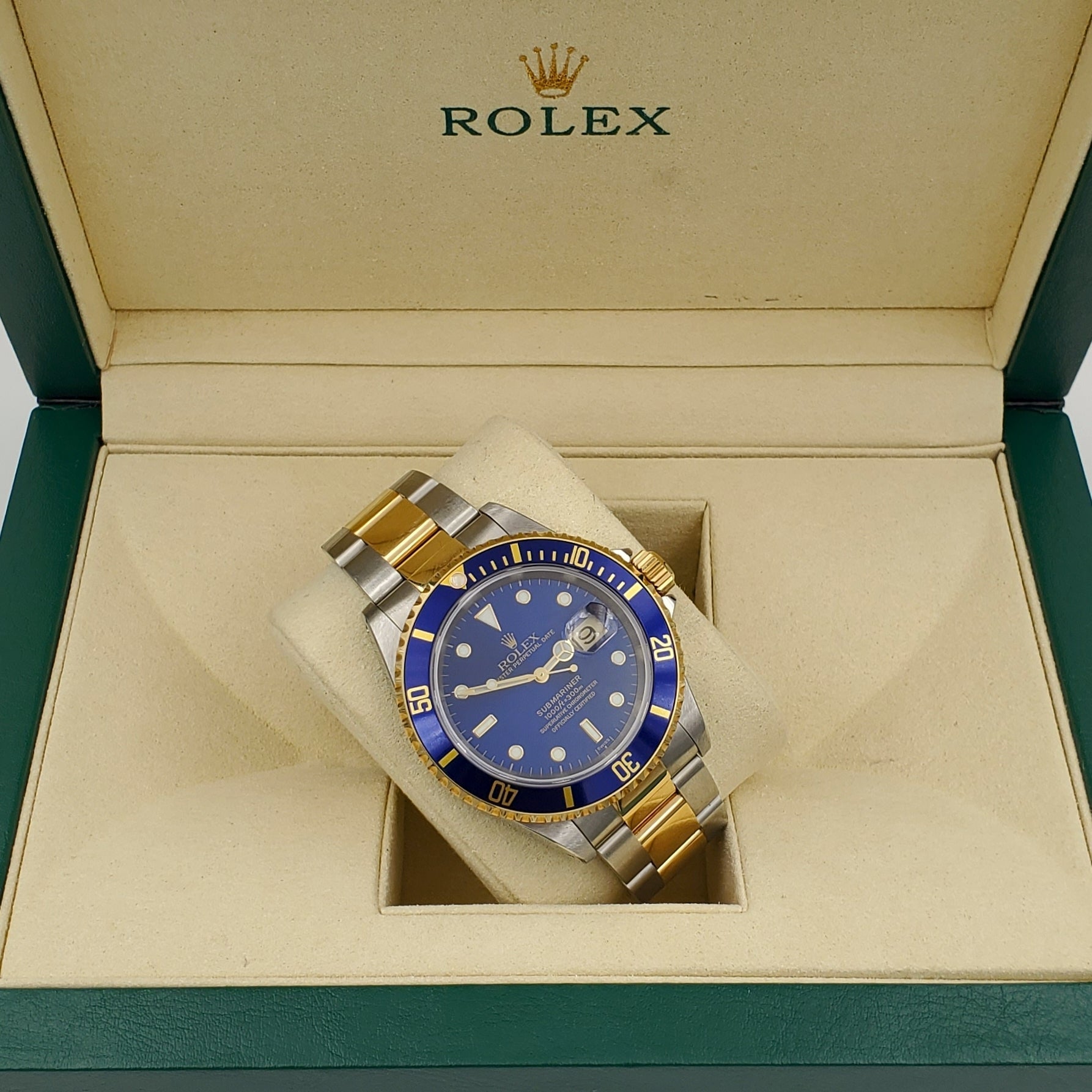 1999 Men's Rolex 40mm Submariner Oyster Perpetual Two Tone 18K Yellow Gold / Stainless Steel Watch with Blue Dial and Blue Bezel. (Pre-Owned 16613)