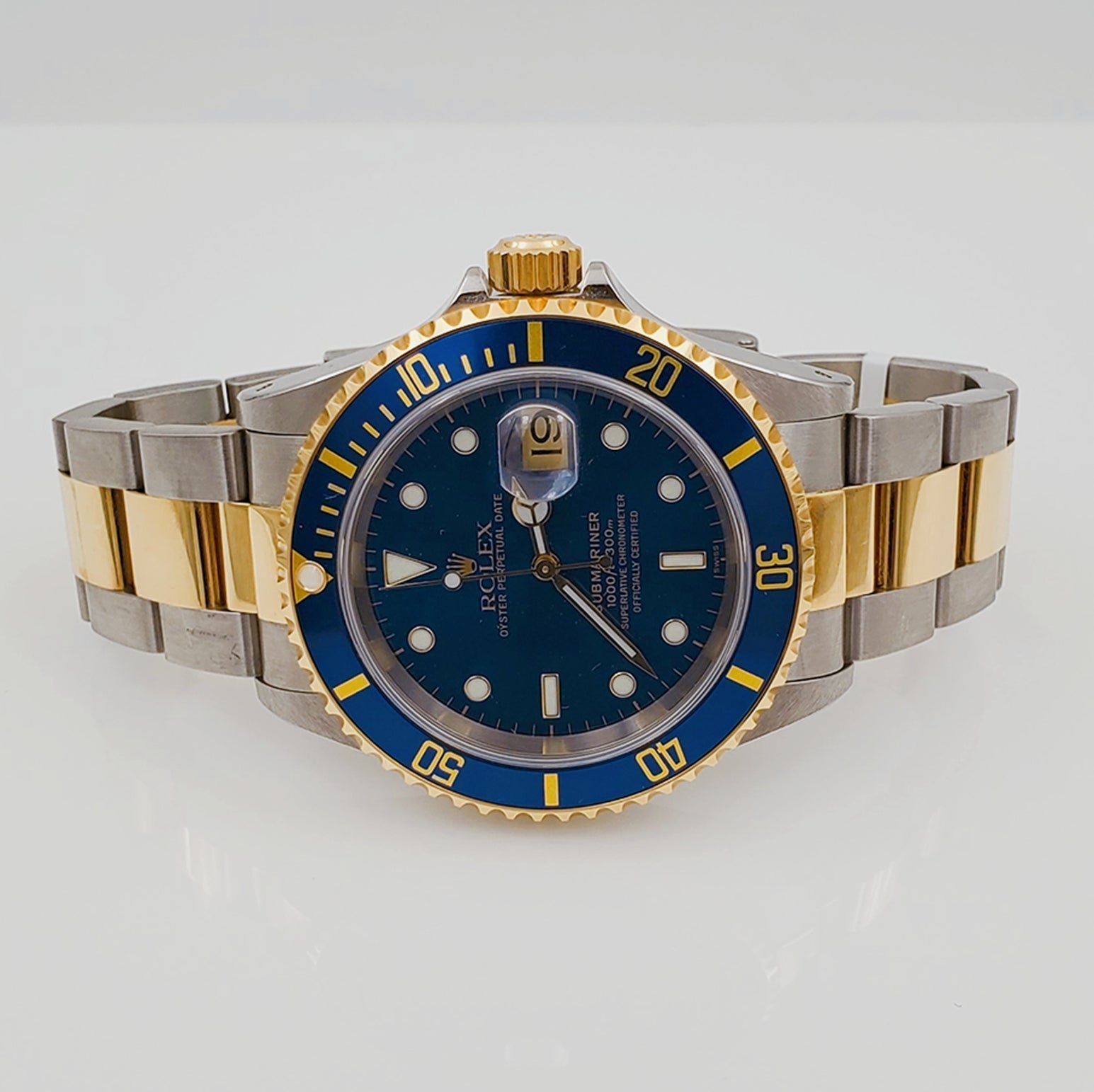 2003 Men's Rolex Submariner 40mm Two Tone Oyster Perpetual 18K Yellow Gold / Stainless Steel Watch with Blue Dial and Blue Bezel. (Pre-Owned 16613)