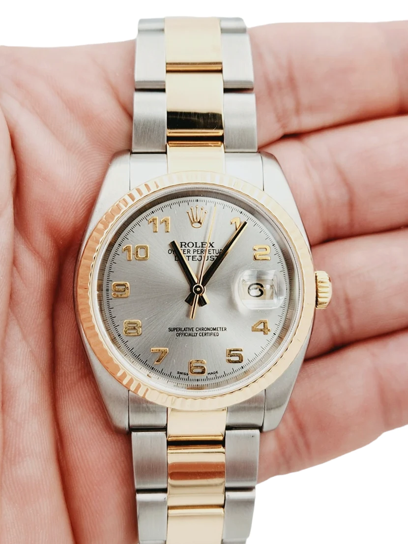 Men's Rolex DateJust 36mm Oyster Perpetual Two Tone 18K Yellow Gold / Stainless Steel Band Watch with Silver Dial and Fluted Bezel. (Pre-Owned 116233)