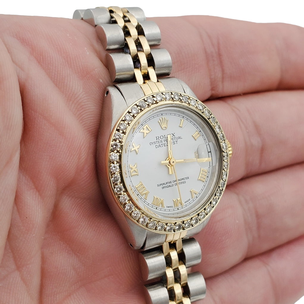 Ladies Rolex 26mm DateJust Two Tone 18K Yellow Gold / Stainless Steel Watch with White Dial and Diamond Bezel. (Pre-Owned 6917)