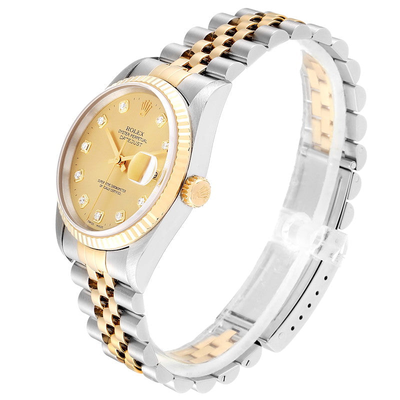 Ladies Rolex 26mm DateJust Two Tone 18K Yellow Gold / Stainless Steel Watch with Champagne Diamond Dial and Fluted Bezel. (Pre-Owned 69173)