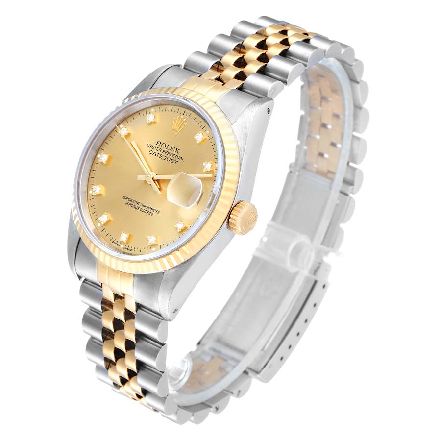 Ladies Rolex 26mm DateJust Two Tone 18K Gold / Stainless Steel Watch with Champagne Diamond Dial and Fluted Bezel. (Pre-Owned)