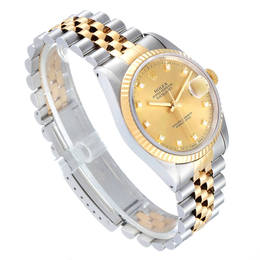 Ladies Rolex 26mm DateJust Two Tone 18K Gold / Stainless Steel Watch with Champagne Diamond Dial and Fluted Bezel. (Pre-Owned)
