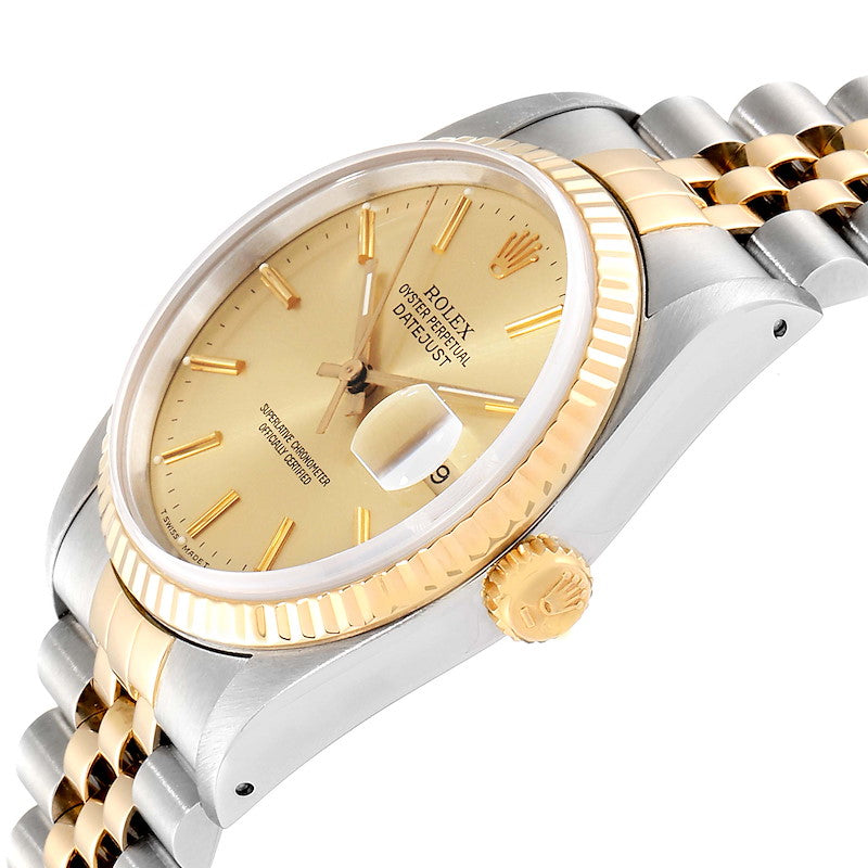 Ladies Rolex 26mm DateJust Two Tone 18K Yellow Gold / Stainless Steel Watch with Champagne Dial and Fluted Bezel. (Pre-Owned)