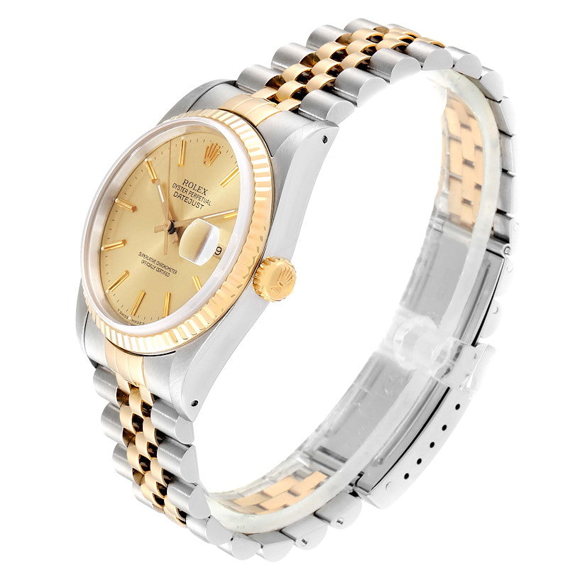 Ladies Rolex 26mm DateJust Two Tone 18K Yellow Gold / Stainless Steel Watch with Champagne Dial and Fluted Bezel. (Pre-Owned)