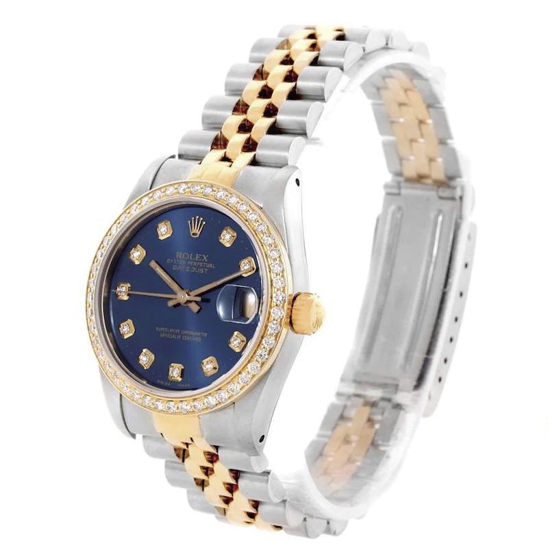 Ladies Rolex 26mm DateJust Two Tone 18K Yellow Gold Watch with Blue Diamond Dial and Custom Diamond Bezel. (Pre-Owned)